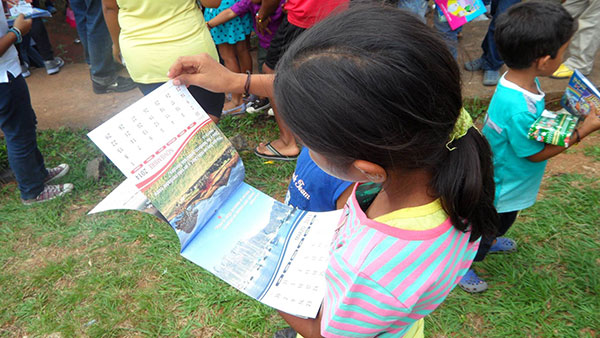 Children from a school receiving Calendars 
and gifts to take home
