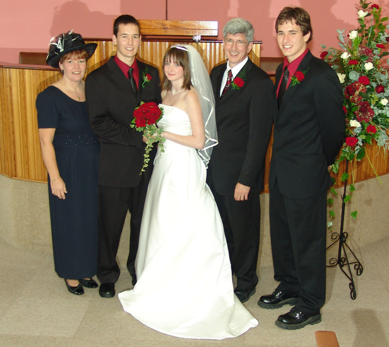 The happy couple and his parents and brother Mark.