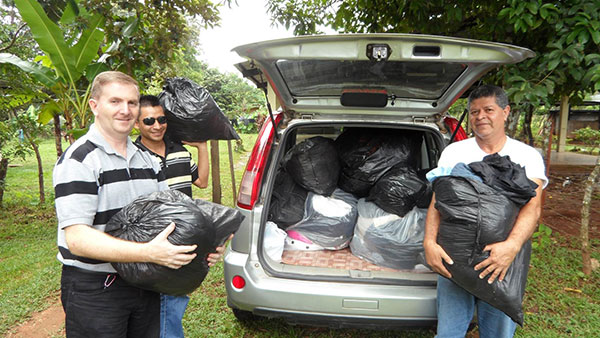 Delivering clothes to believers in El Piro